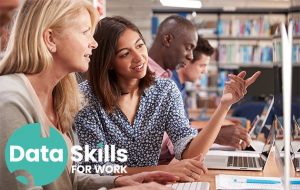 Two women looking at a computer